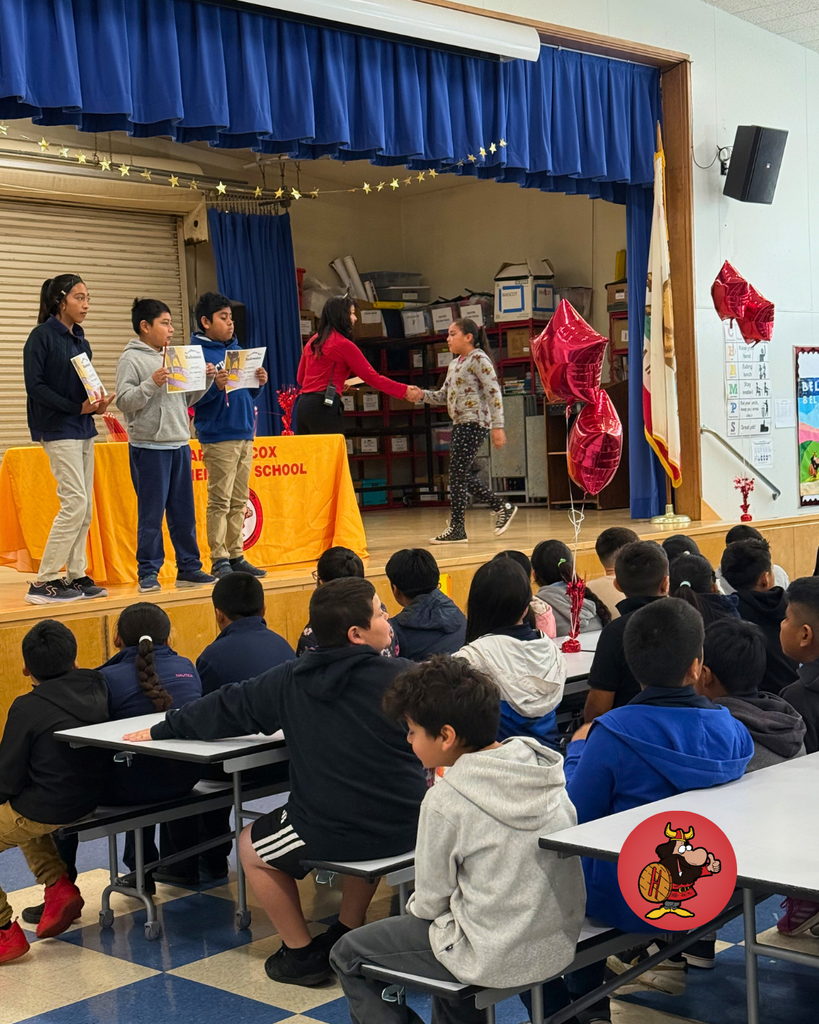 Students being honored with certificates