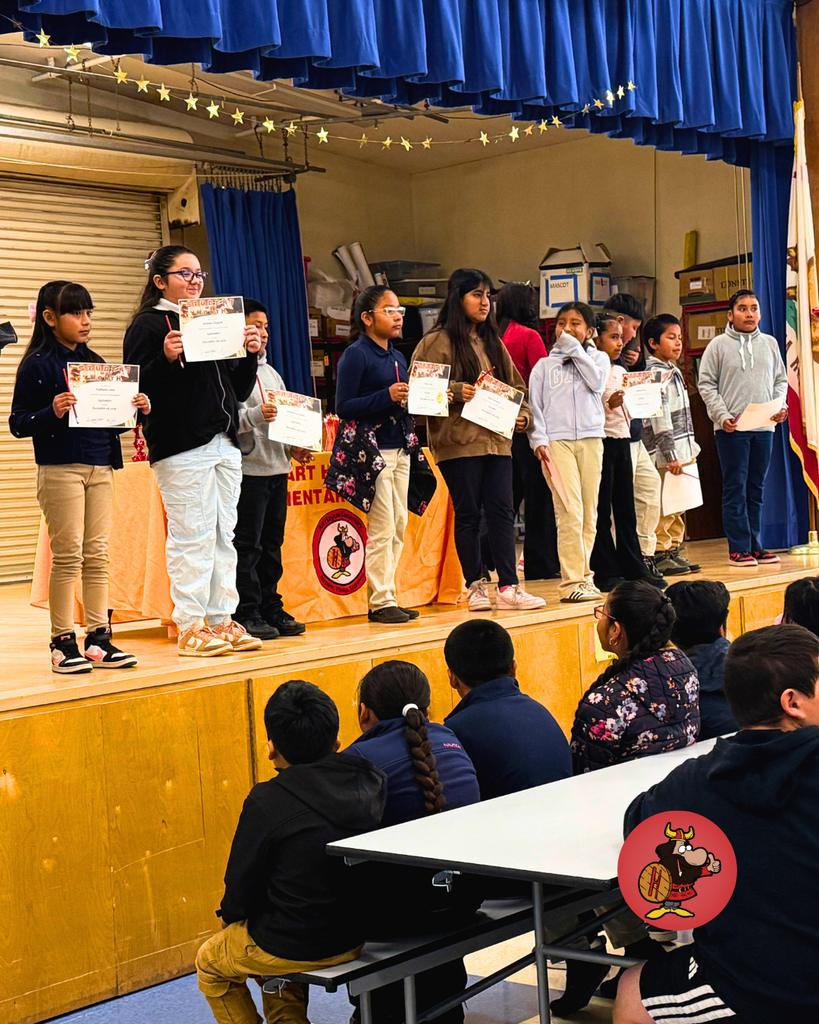 Students being honored with certificates