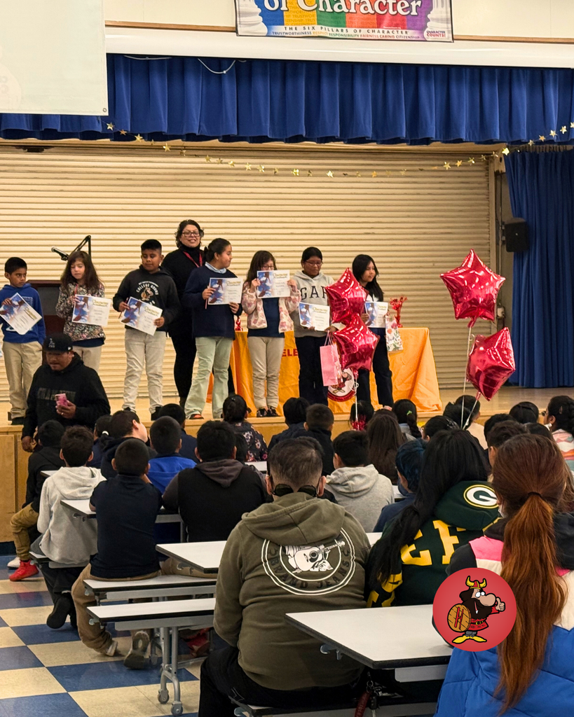 Students being honored with certificates