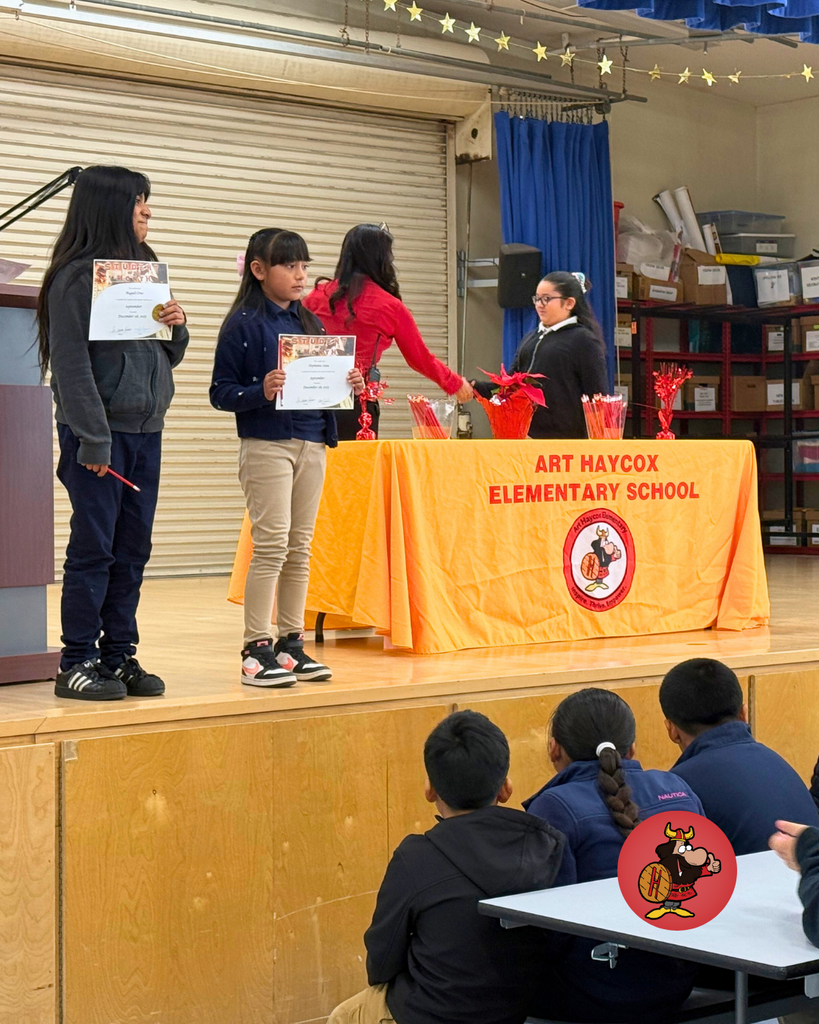Students being honored with certificates