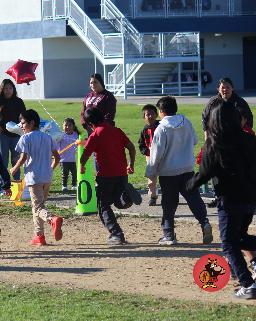 bunch of kids running fast to finihs line