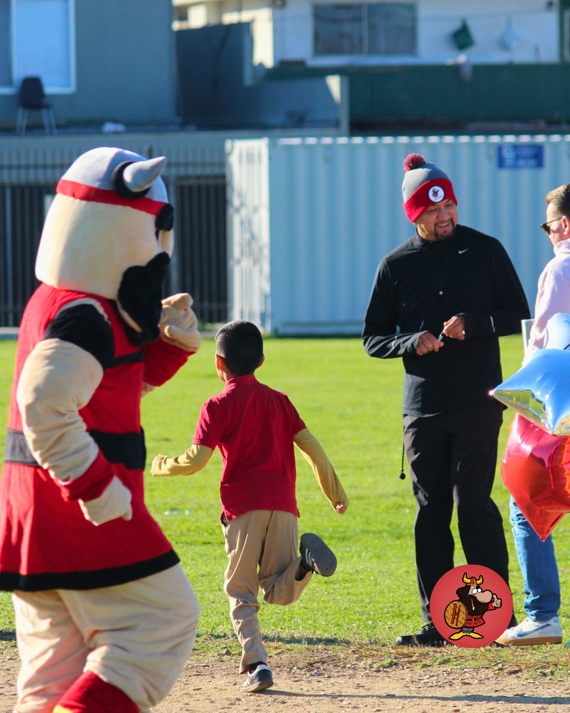 viking cheering students on while they run