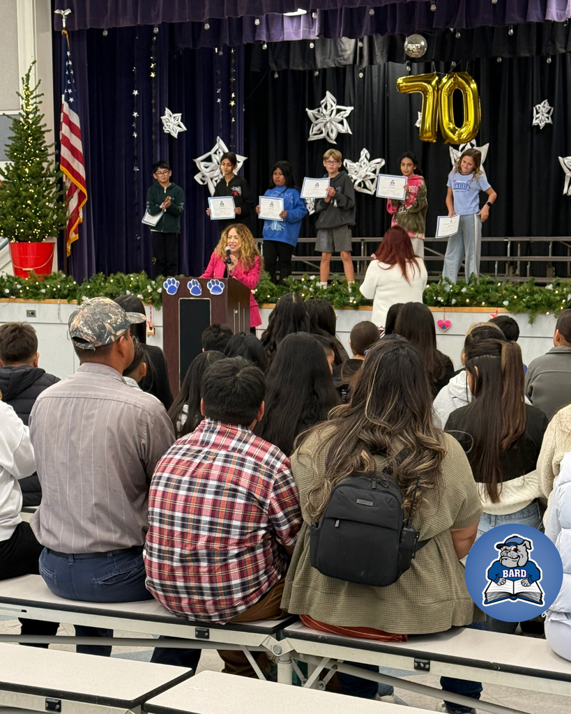 teacher announcing award winners