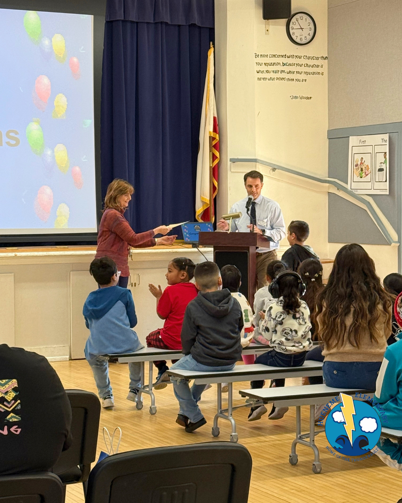 teacher announcing award winners