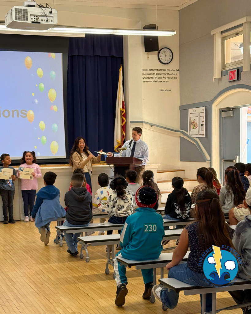 teacher announcing award winners