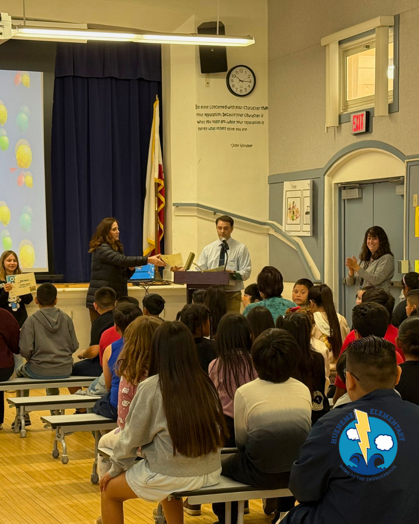 teacher announcing award winners