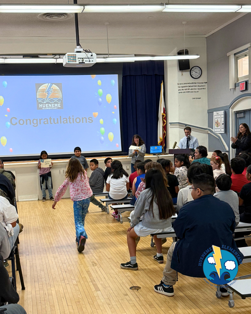 student walking to accept award