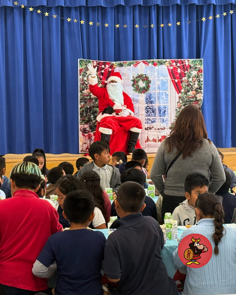 student giving santa a high five