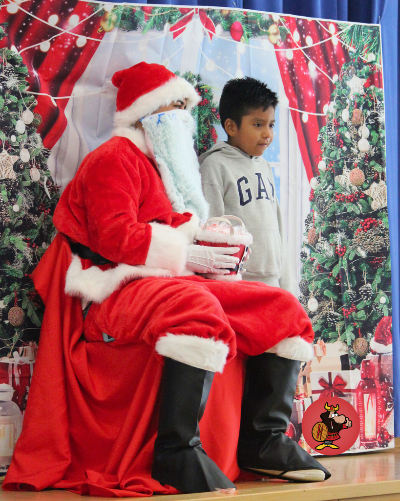 student giving santa a high five