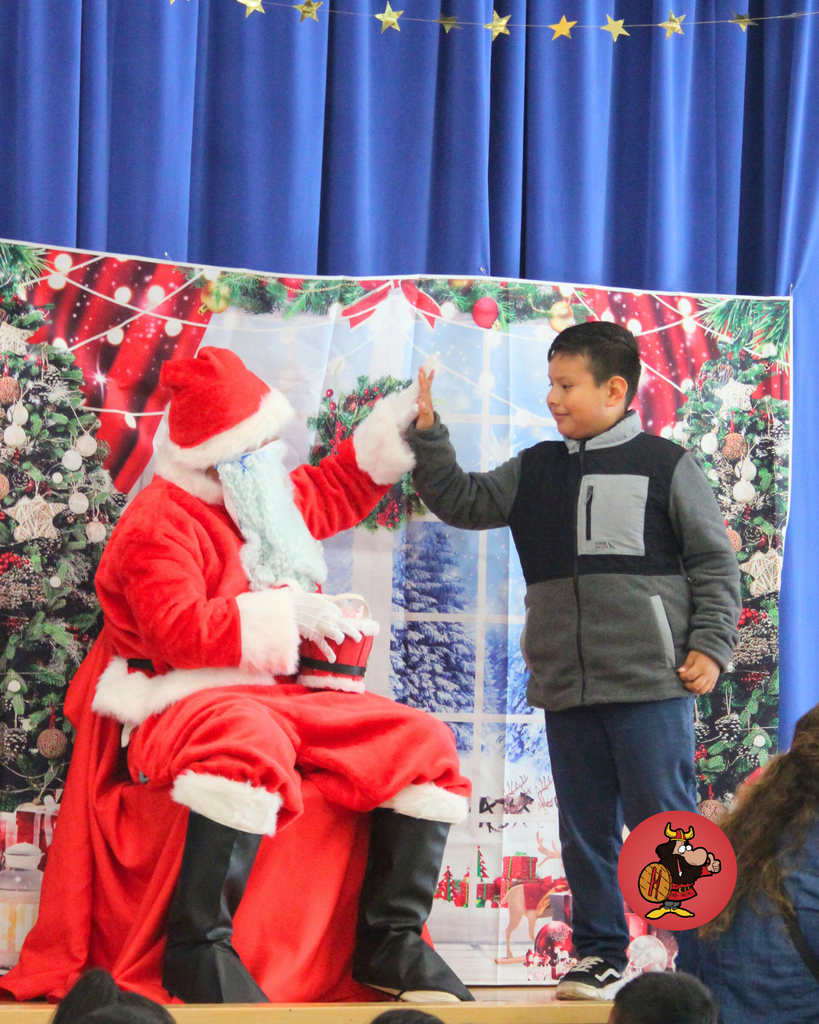 student giving santa a high five