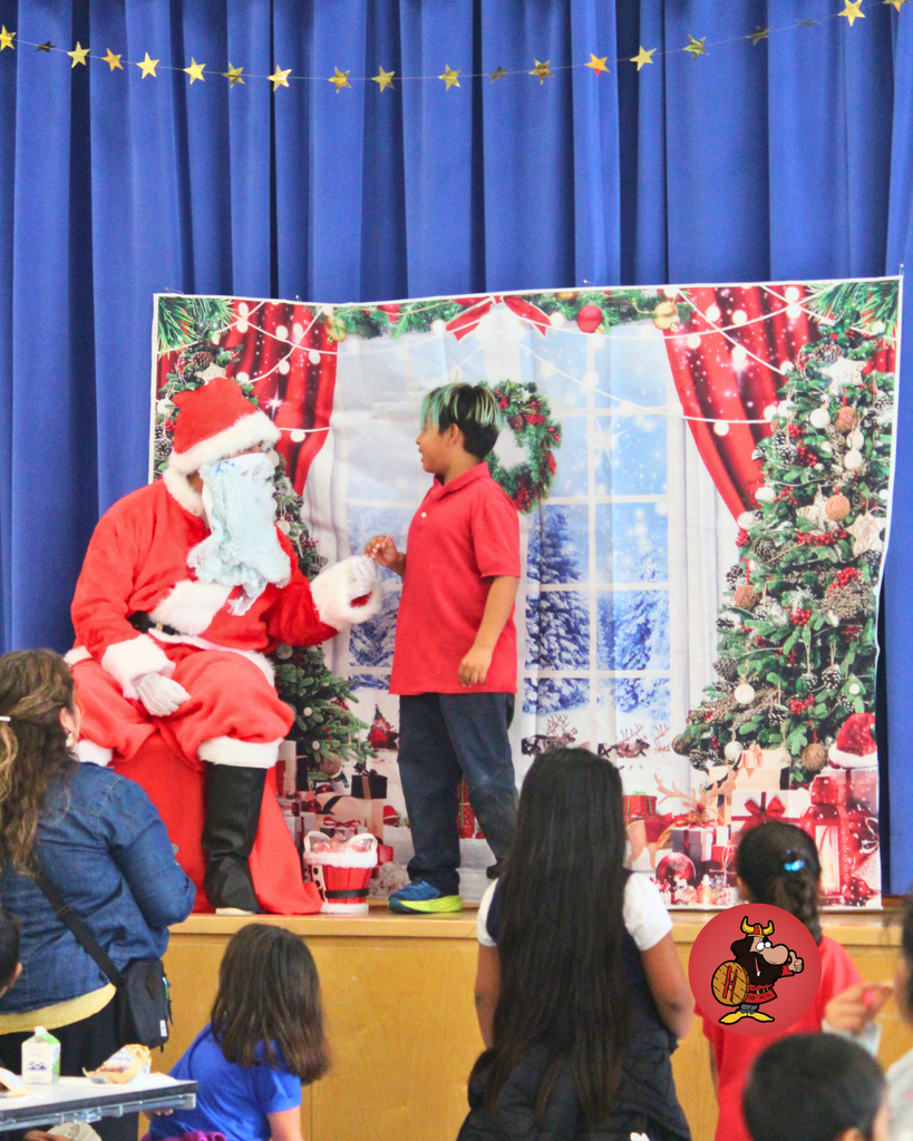 student giving santa a high five