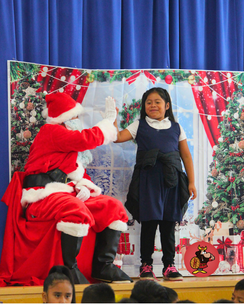 student giving santa a high five
