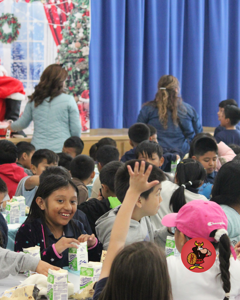 student giving santa a high five