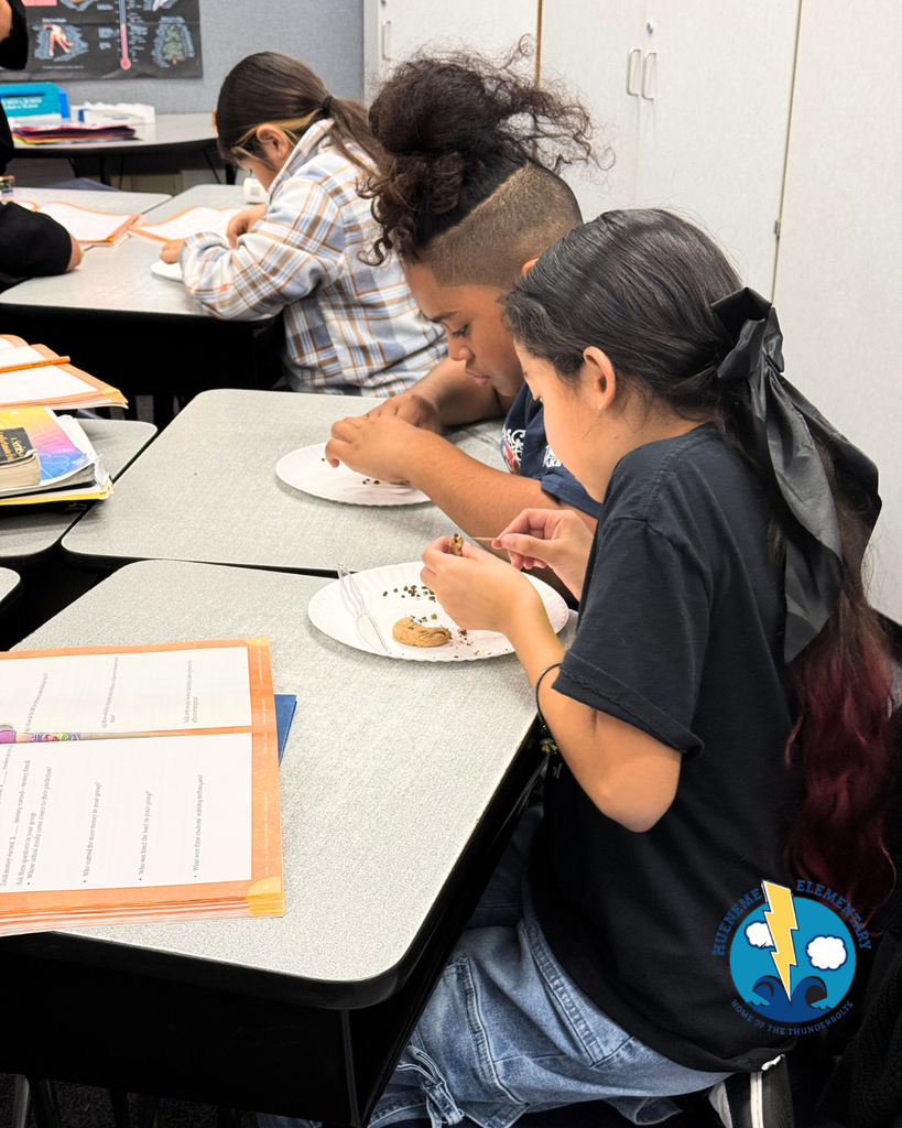 student participating in mining activity, mining a cookie