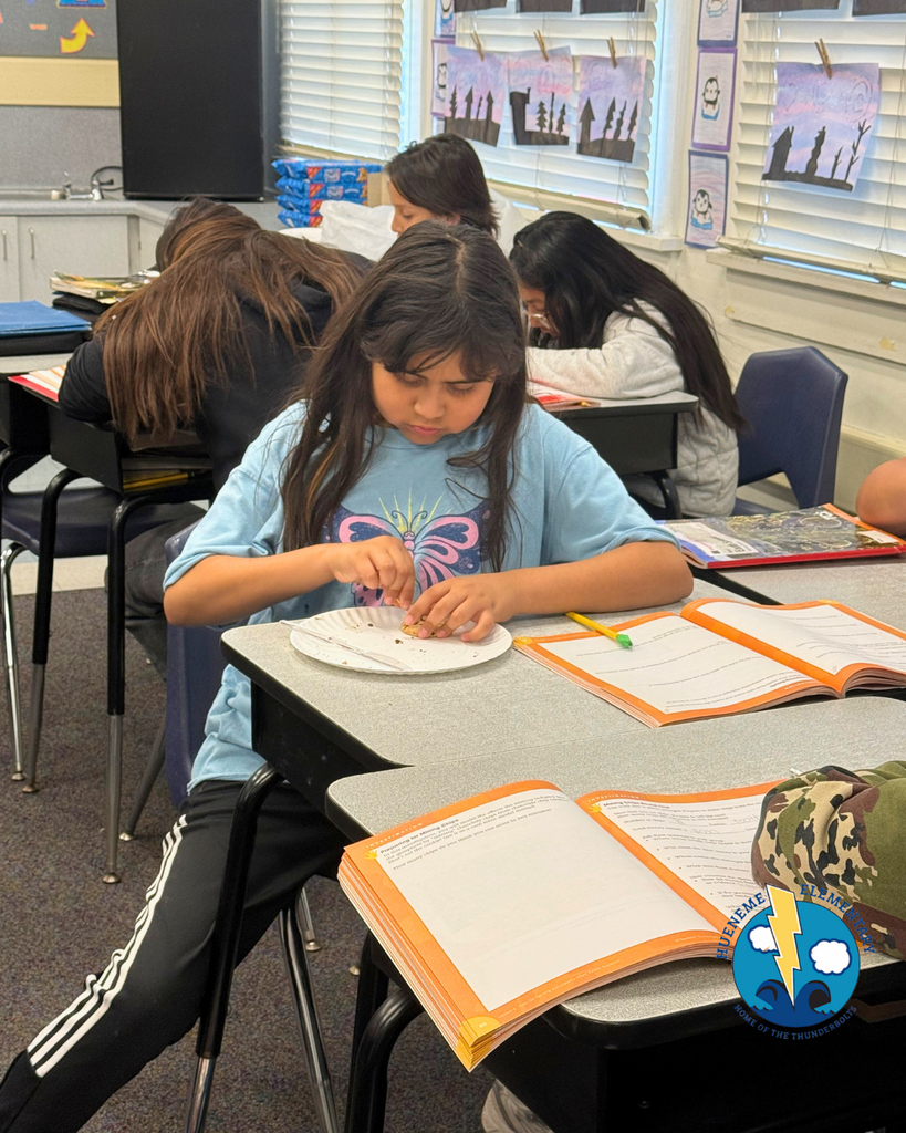 student participating in mining activity, mining a cookie