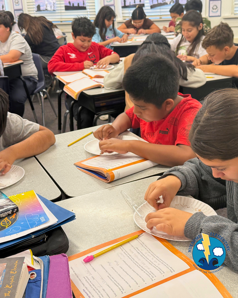student participating in mining activity, mining a cookie