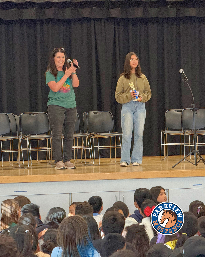 teacher announcing winner of spelling bee