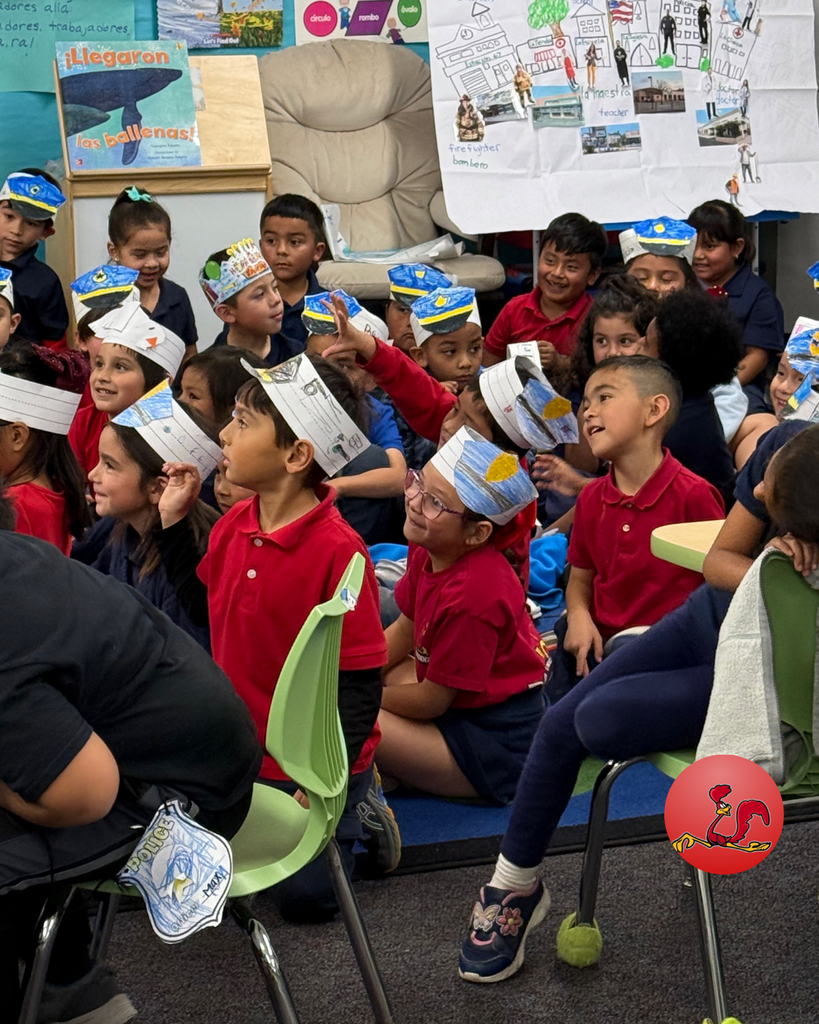 police officer answering students questions on community helper day