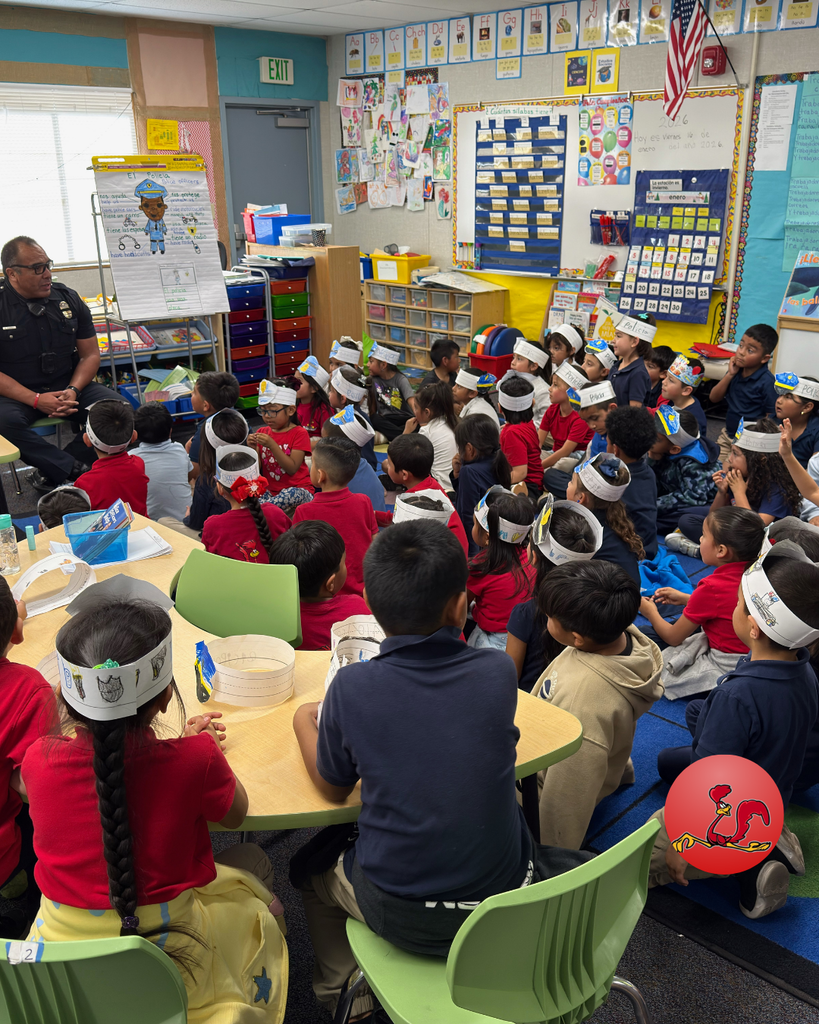 police officer answering students questions on community helper day