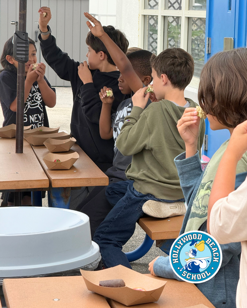 students enjoying different color fruits