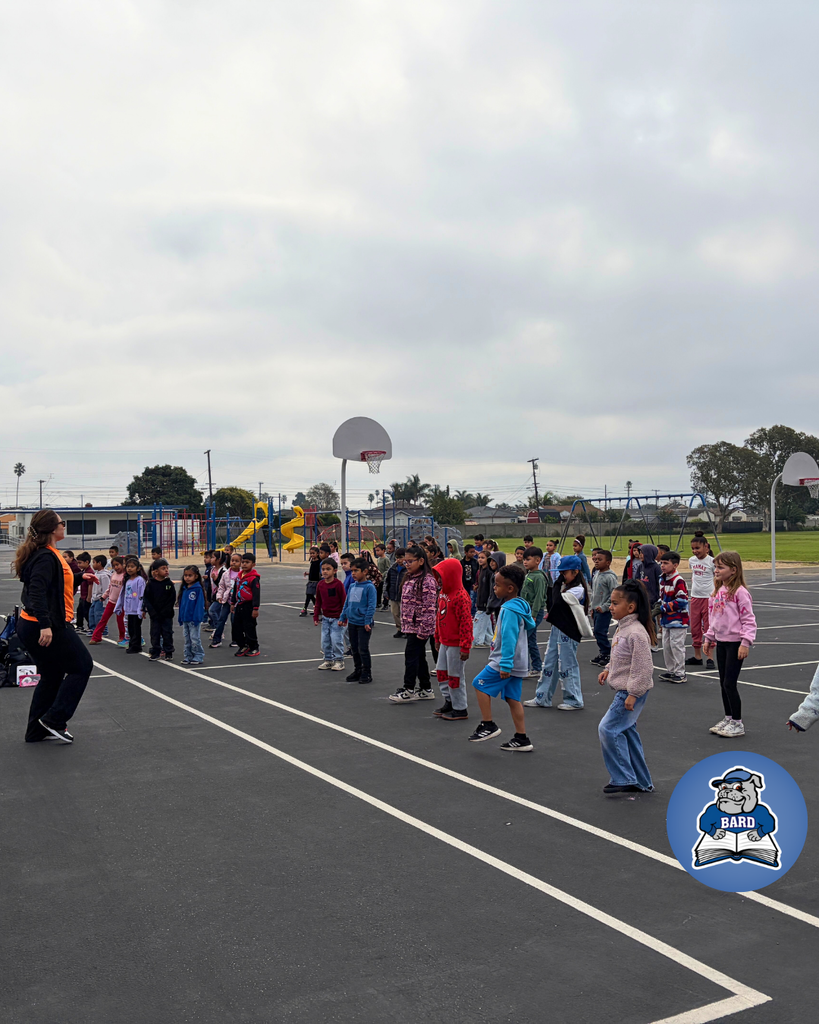 Teacher instructing students on dance moves