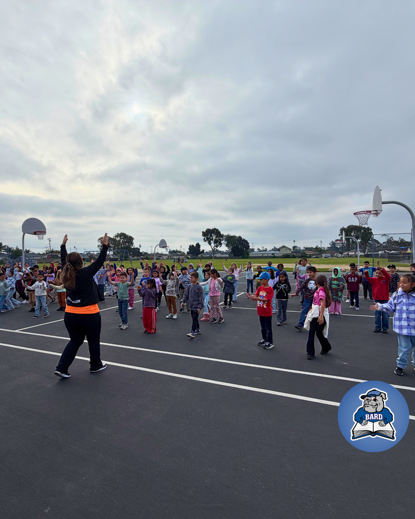 Teacher instructing students on dance moves