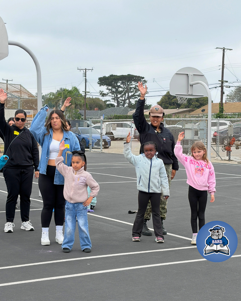 Teacher instructing students on dance moves