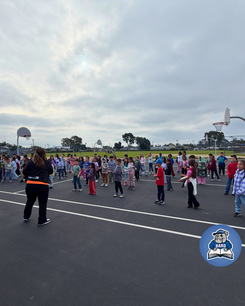 Teacher instructing students on dance moves