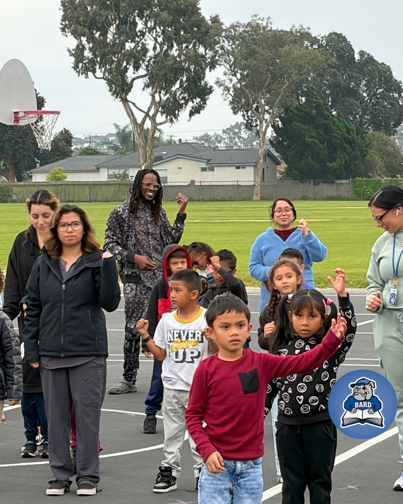 Teacher instructing students on dance moves