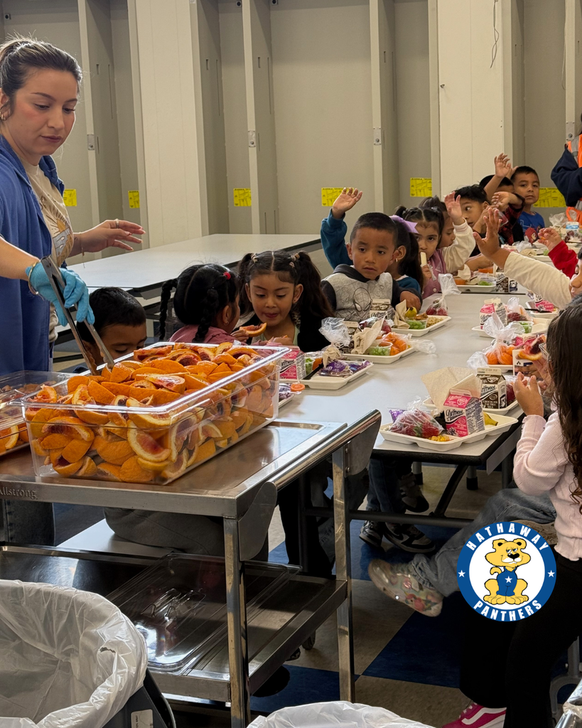 students eating blood oranges for harvest of the month