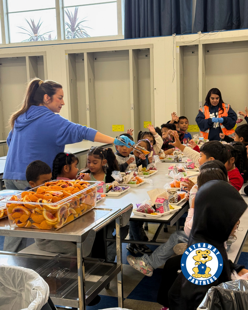 students eating blood oranges for harvest of the month