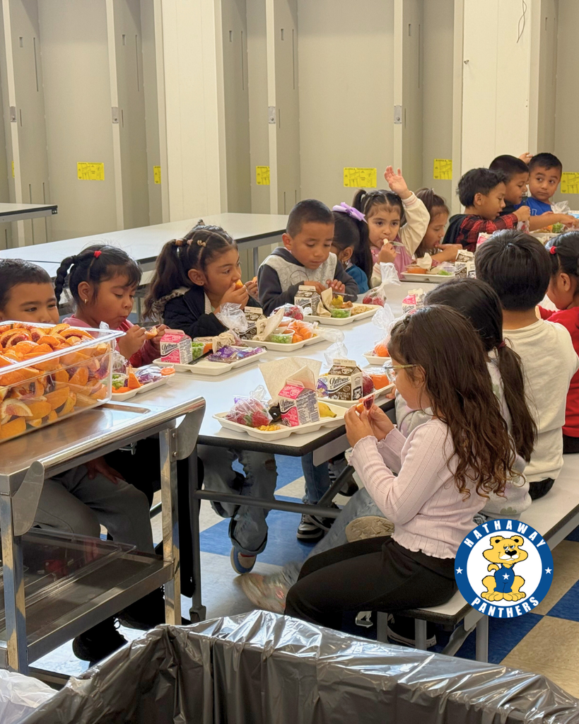 students eating blood oranges for harvest of the month