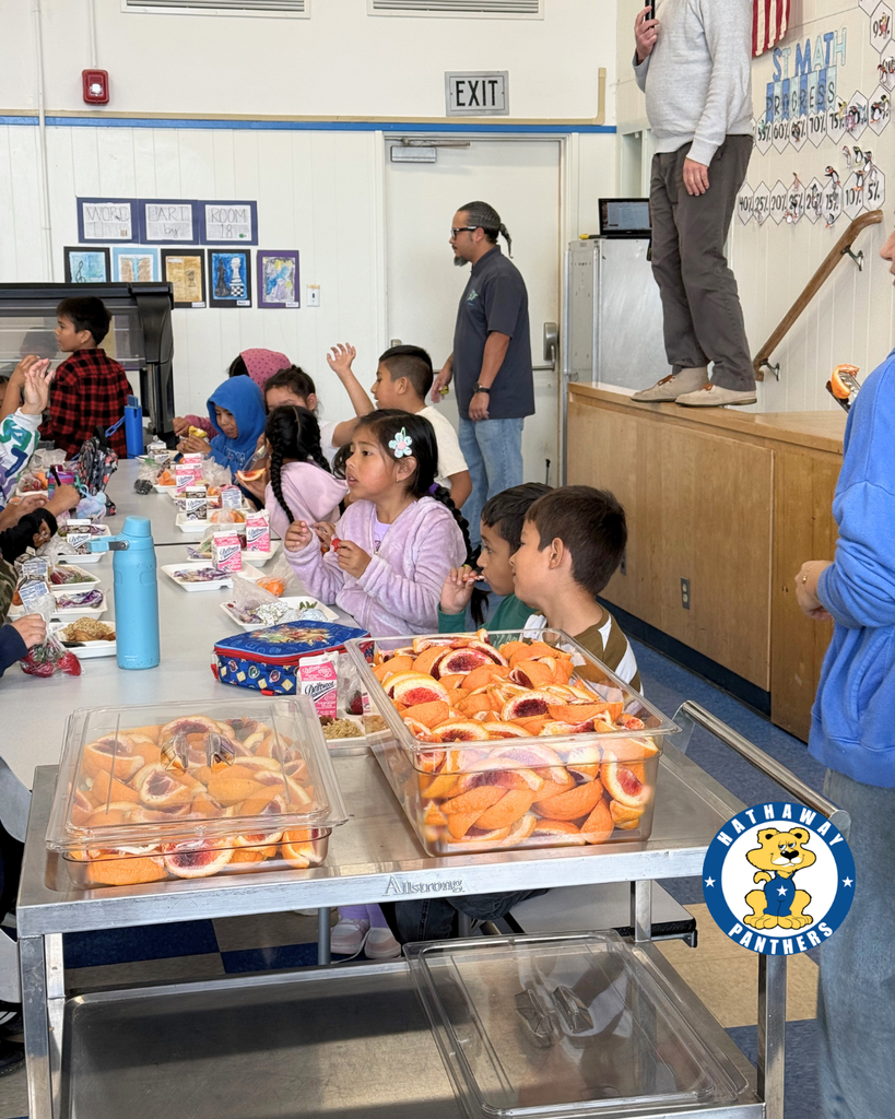 students eating blood oranges for harvest of the month