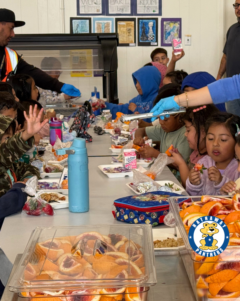 students eating blood oranges for harvest of the month