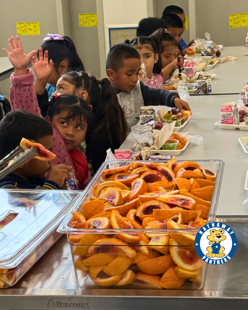 students eating blood oranges for harvest of the month