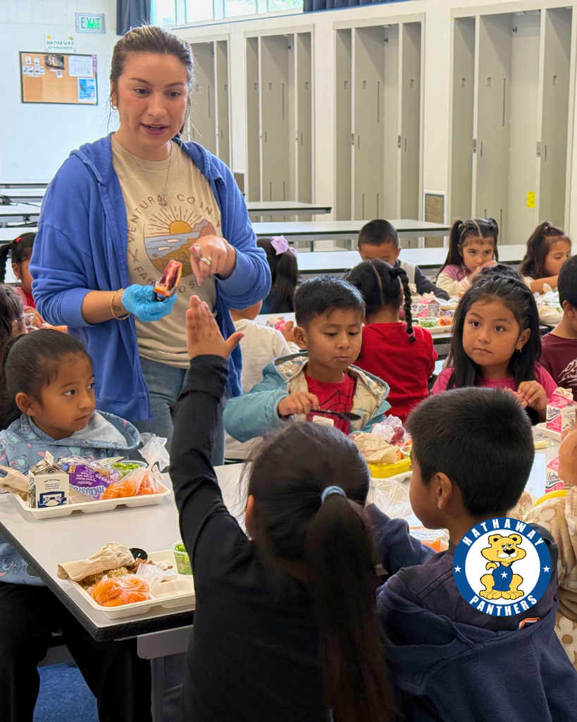 students eating blood oranges for harvest of the month