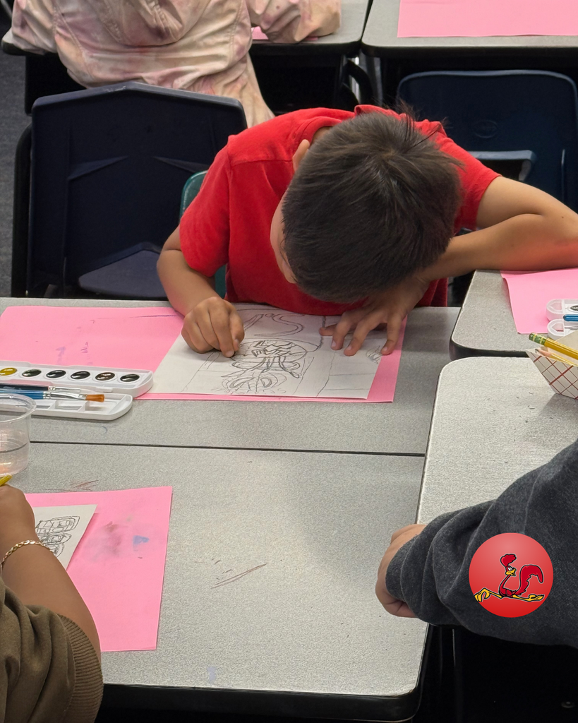 student participating in art class