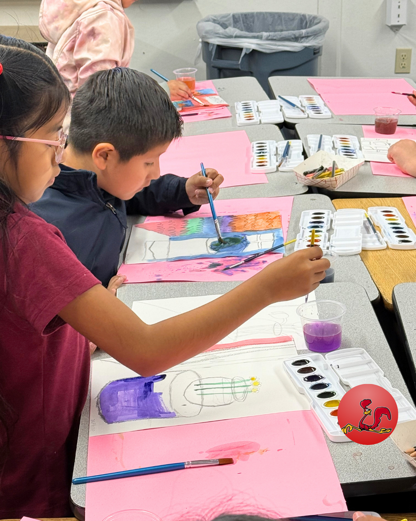 student participating in art class