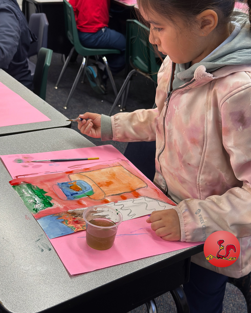 student participating in art class