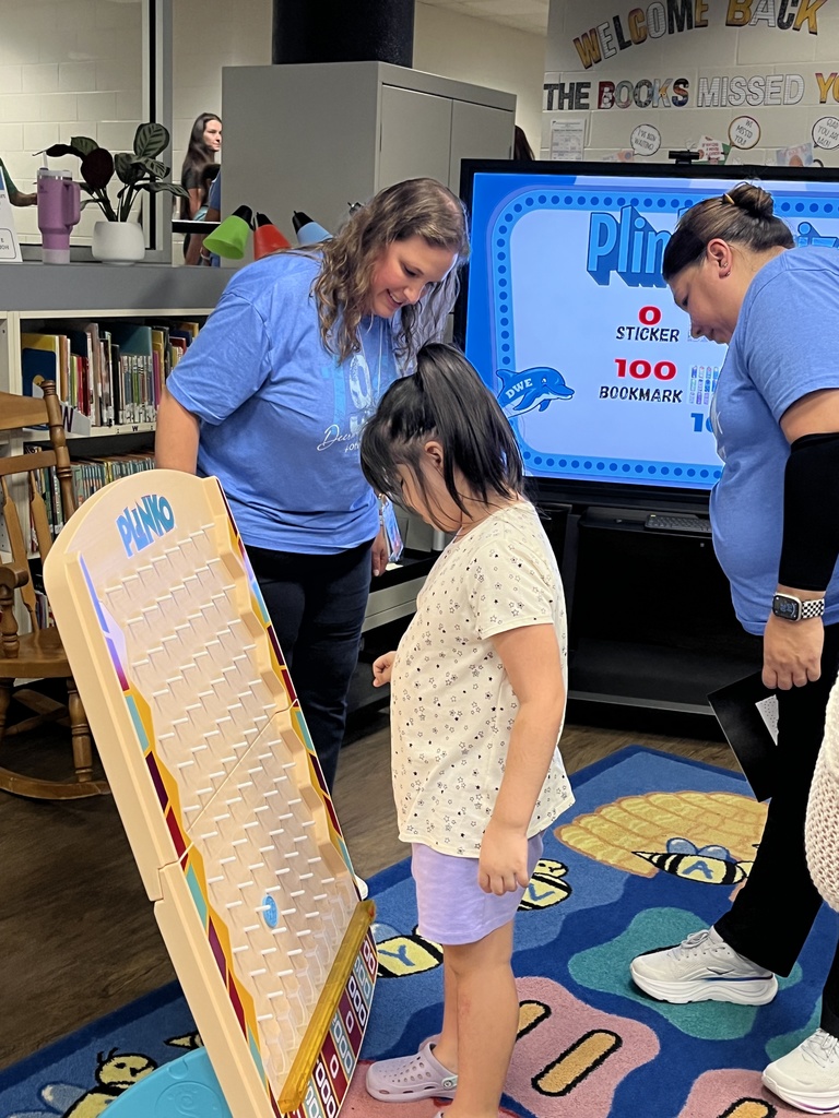 Student playing Plinko