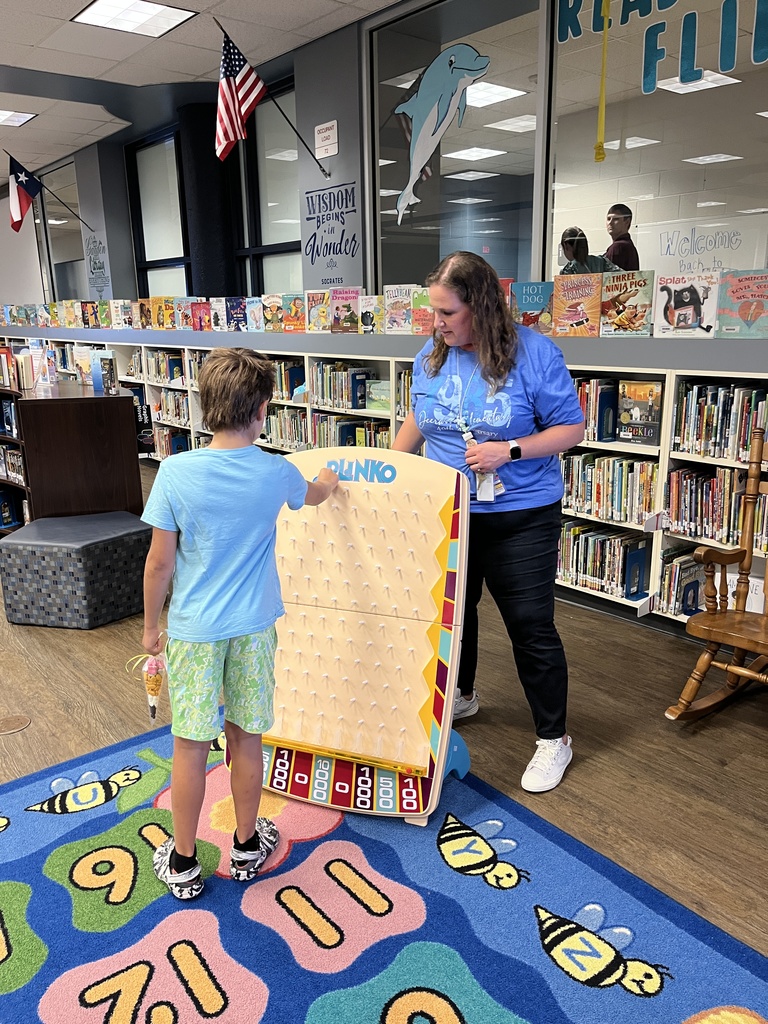 Student playing Plinko