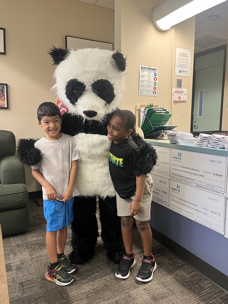 image of two students posing with our Panda mascot