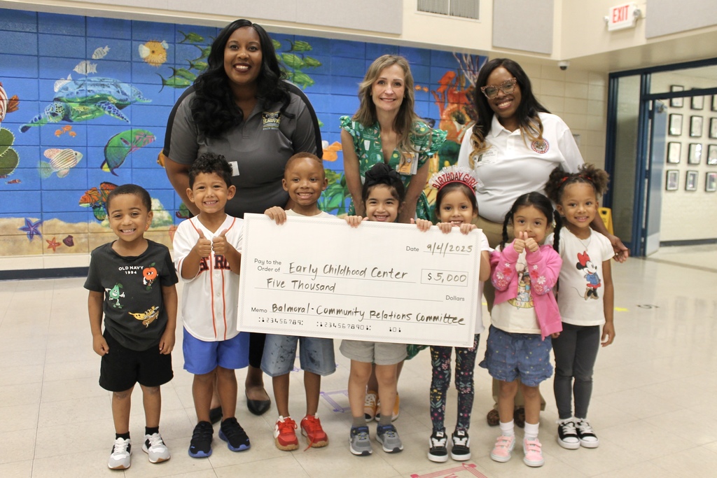 Balmoral representatives pose with ECC principal Amanda Price and ECC students