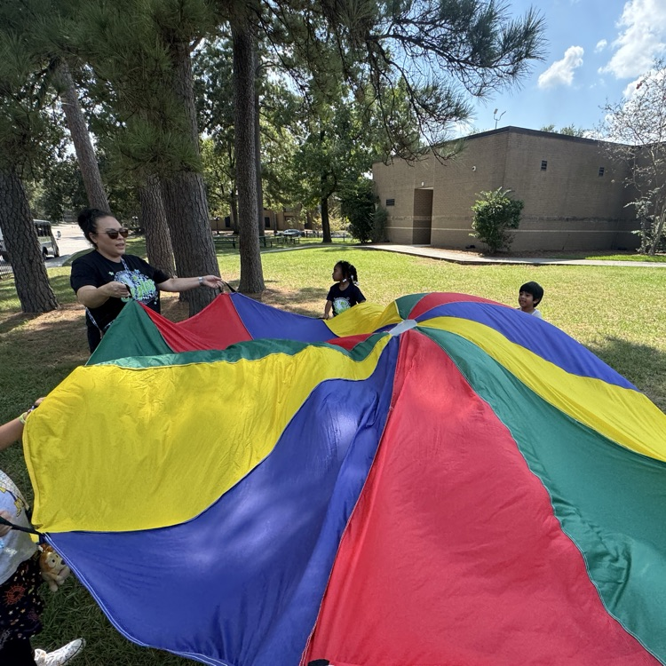 kids playing with parachute