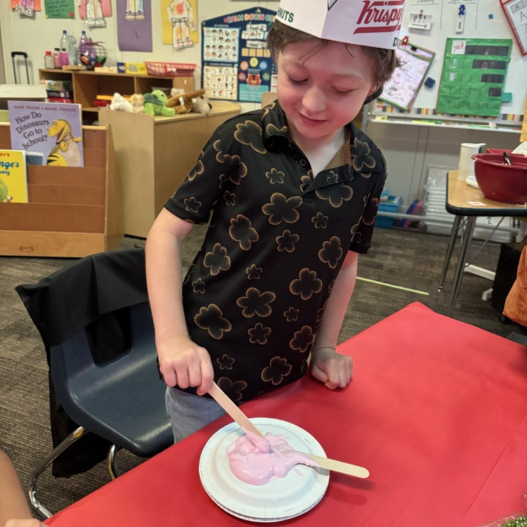 student decorating donut craft