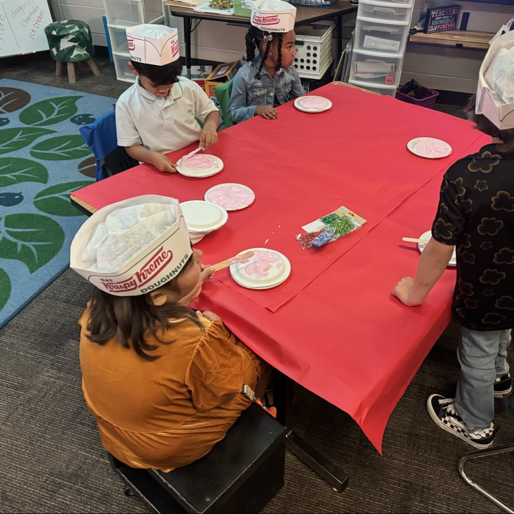 student decorating donut craft