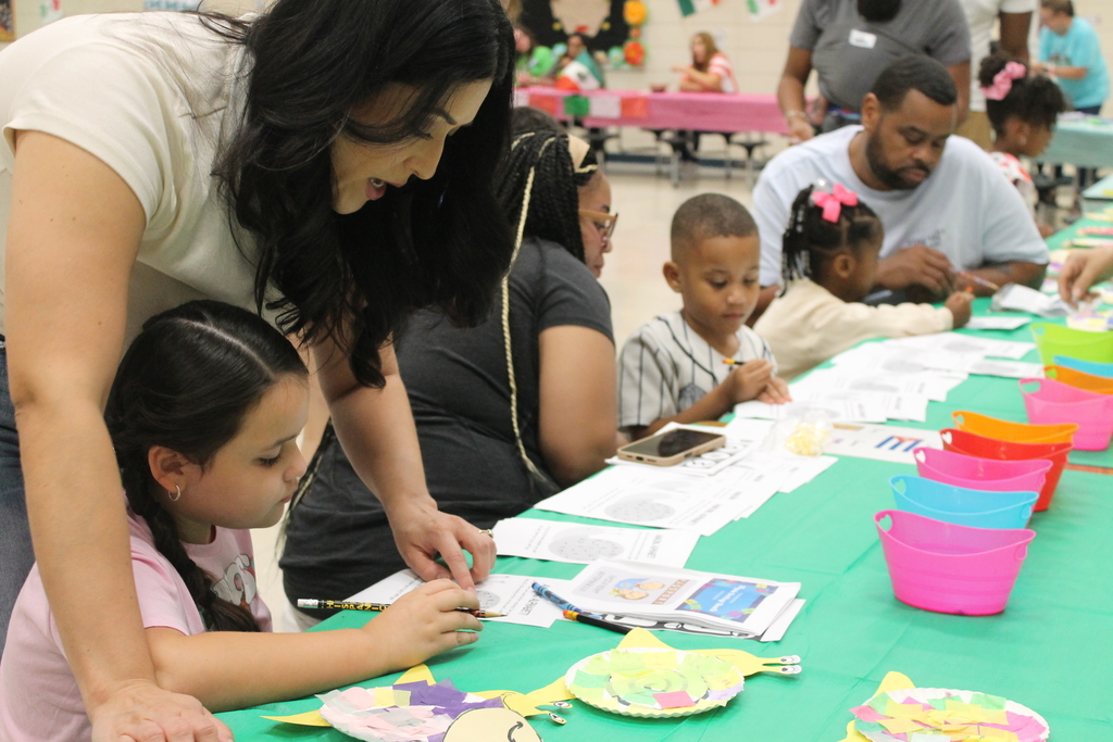 ECC parents and students collaborate on a literacy activity at HHM Literacy Night