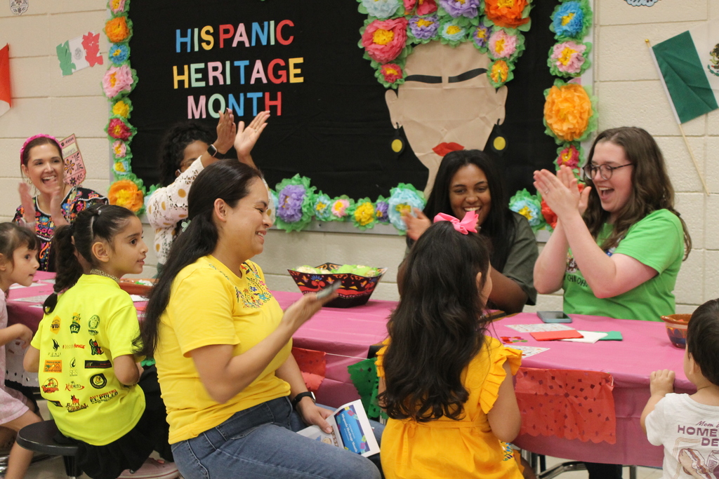 ECC families and staff celebrate a bingo win at HHM Literacy Night