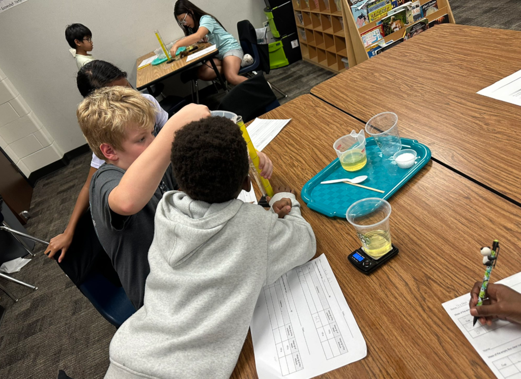 Students exploring conservation of matter
