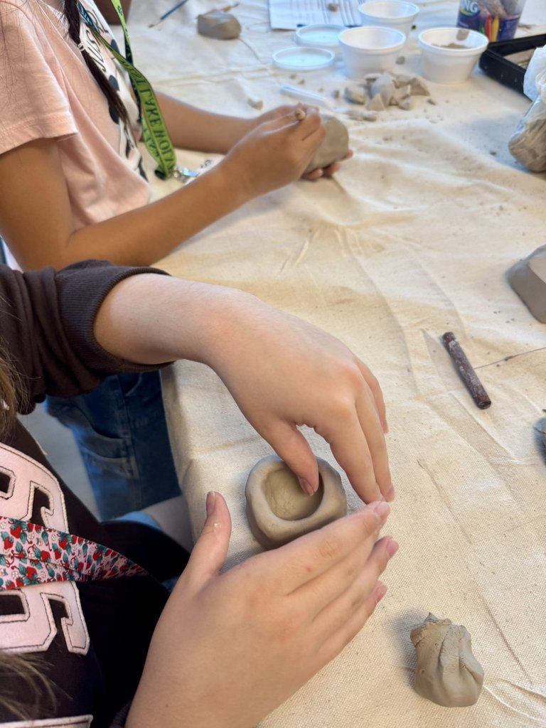 students working with clay